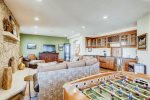 Living area with wet bar, and foosball table
